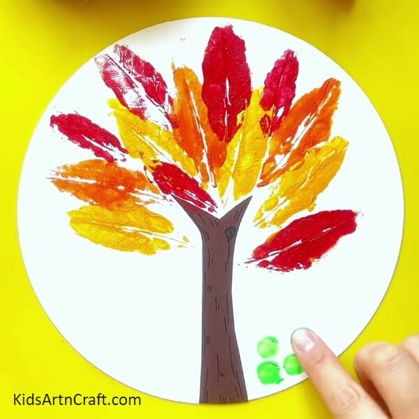 Making The Base Of The Tree-Instructions for children to create a tree painting with leaf prints