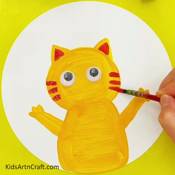 Pasting The Googly Eyes-Instructing Children on the Process of Capturing a Fish with a Cat