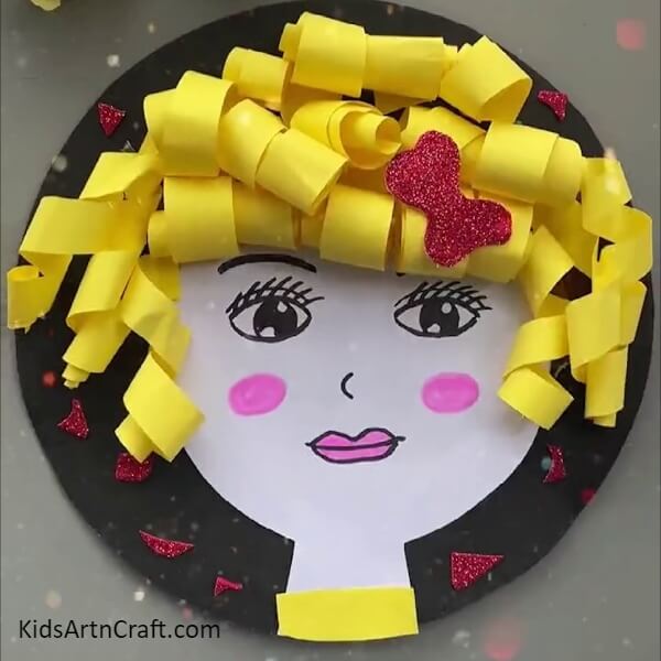 Putting glittering around hairs. Charming Doll Face Craft Step-by-step guide For Kids.