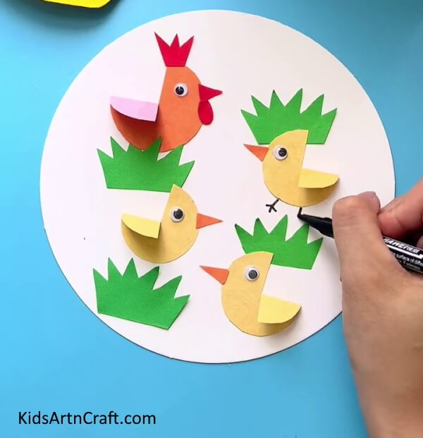 Drawing The Chicken's Legs - A straightforward home activity for Easter making chickens decorations.