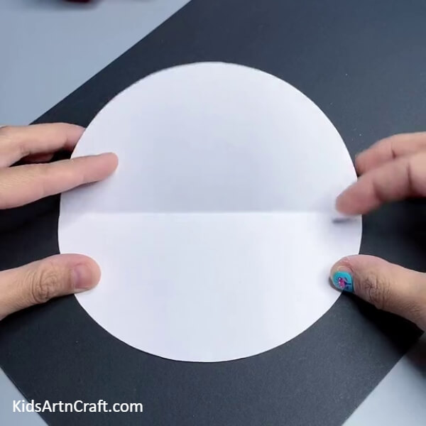 Folding A Circle- A Guide to Crafting a Santa Claus Design with Paper for Novices 