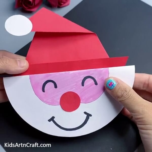 This Is The Final Look Of Our Paper Santa Claus Face Craft- A Tutorial to Making a Christmas Santa Figure Out of Paper for Starters 