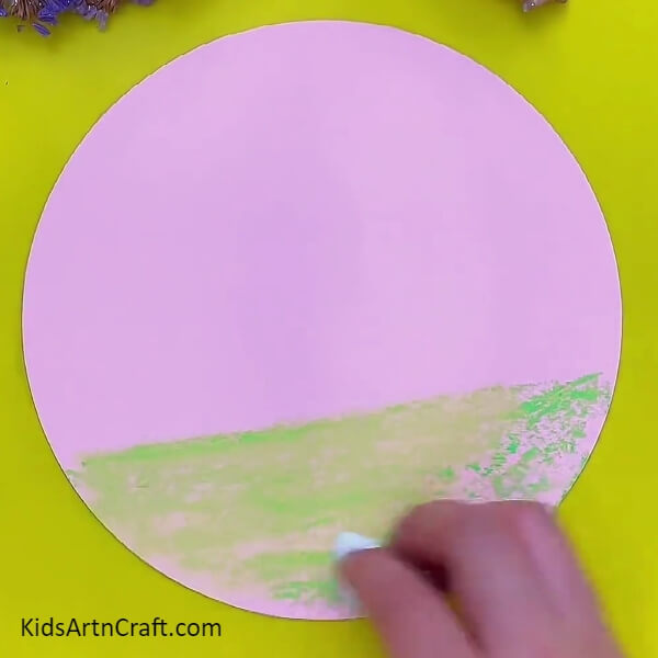 Wiping On Green Colored Area With Tissue Paper- Crafting of flowery landscape for kids