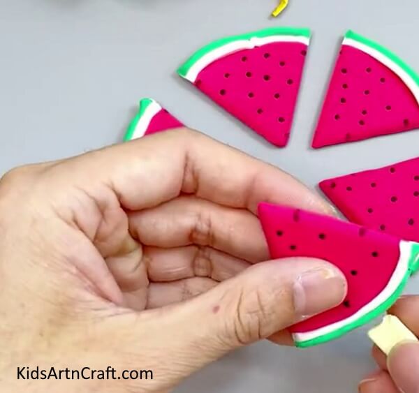 Inserting Ice Cream Stick In The Watermelon Slice - A tutorial to help you create clay watermelon ice cream.