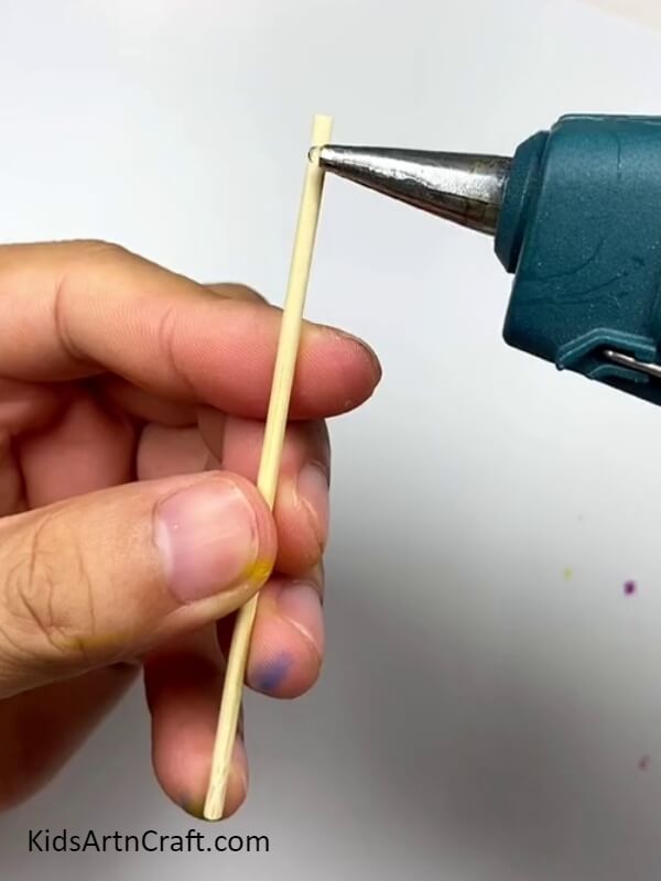 Applying Hot Glue Gun - How to Assemble a Colorful Cotton Earbud Windmill - A Tutorial for Beginners 