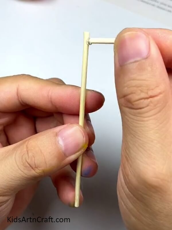 Pasting Another Stick - Create a Colorful Cotton Earbud Windmill with This Easy-to-Follow Tutorial 