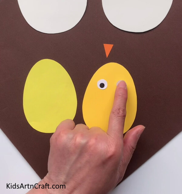Cutting Out Eggs And Making Eyes Tutorial for creating brilliant Easter Eggs with children.
