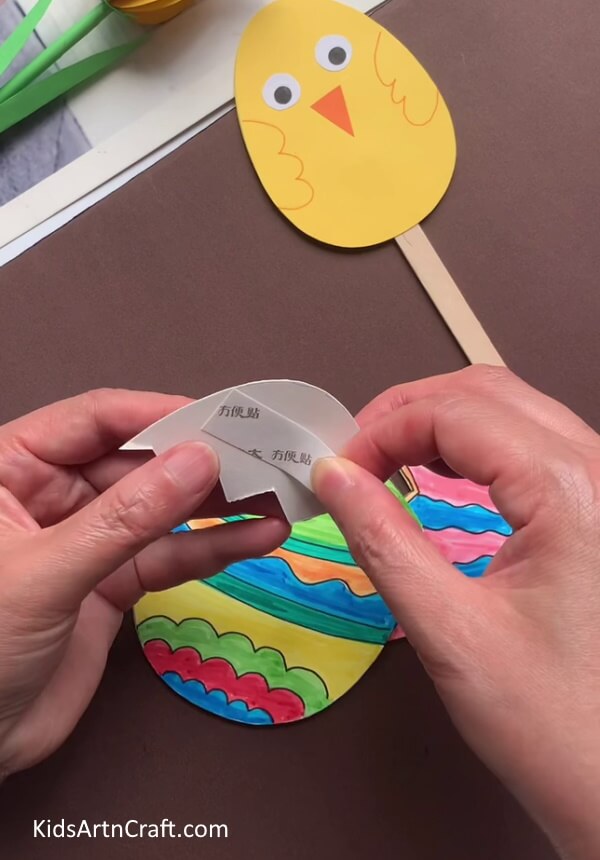 Applying Double-Sided Tape For kids: A guide to making eye-catching Easter Eggs. 