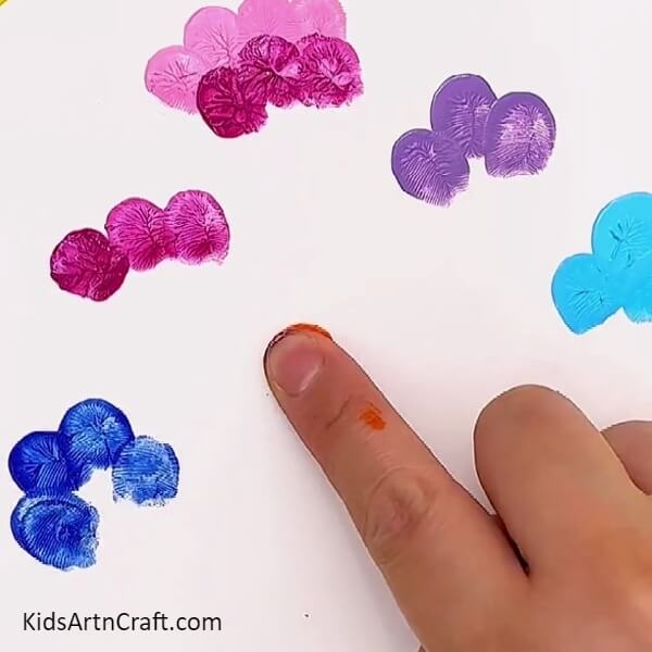 Keeping making prints from your favourite colours- A Step-by-Step Guide to Crafting Colorful Flower Fingerprint Paintings for Kids 