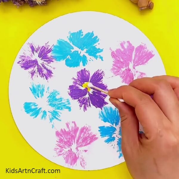 Stamping Some Purple Flowers-Children can create beautiful blooms using plastic