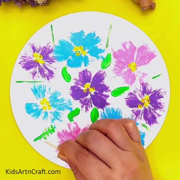 Making Small Dots Around The Lines-Using plastic to craft colorful flowers for youngsters