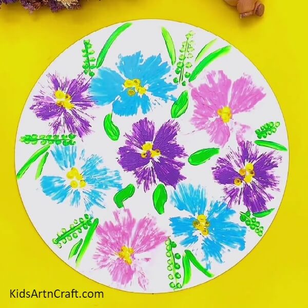 Painting Some More Leaves-Kids can bring color to their crafts with polythene flower making