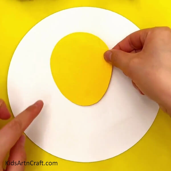 Pasting An Oval Shaped Yellow Cut-Out- Tutorial for Creating Colorful Lion Artwork with Kids 