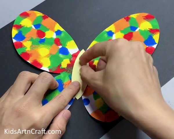 Making The Butterfly's Body Assemble a Colorful Butterfly Craft out of Paper for Your Kids