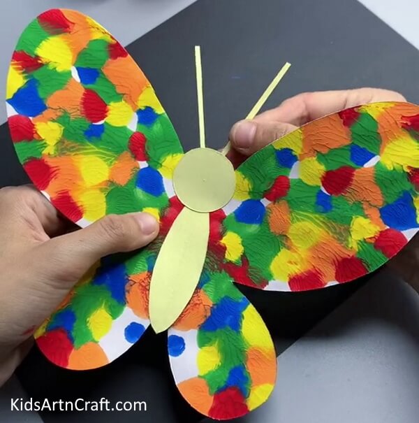 Making The Antennas - Make a Vibrant Paper Butterfly Craft for Your Kids 