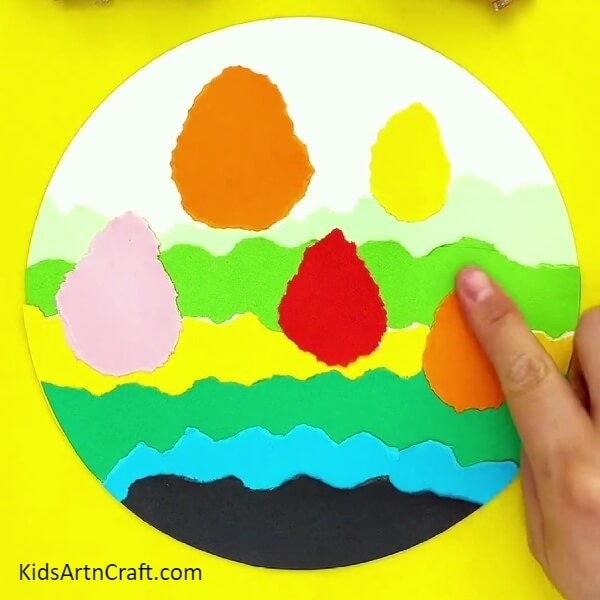 Pasting More Trees-Let your kid's imagination come alive with this colorful tree landscape craft