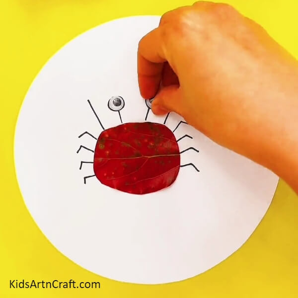 Pasting Googly Eyes - Adorable Crab Submarine Scene Step-by-step Crafting Guide