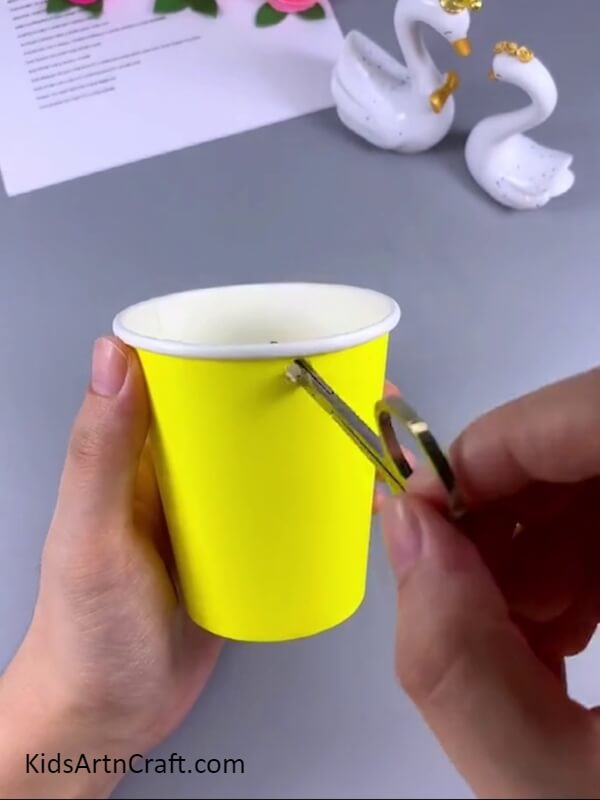 Making a similar hole in the cup- Here's a fun DIY project for the kids: transforming a plastic bottle into an adorable elephant water dispenser.