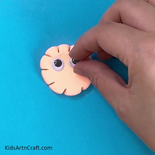 Attaching The Eyes Of The Clay Monster- Pretty little monsters made with clay working