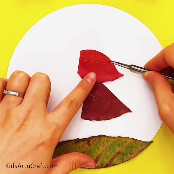 Take A Red Leaf And Make A Scarf Of The Riding Hood From It-Applying Fall Leaves to Form a Delightful Little Red Riding Hood
