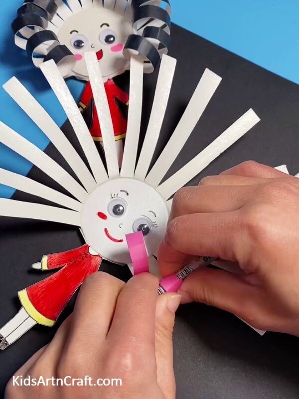 Rolling The Strips To Make The Hair- Learn How to Create a Paper Cup Doll for Kids 