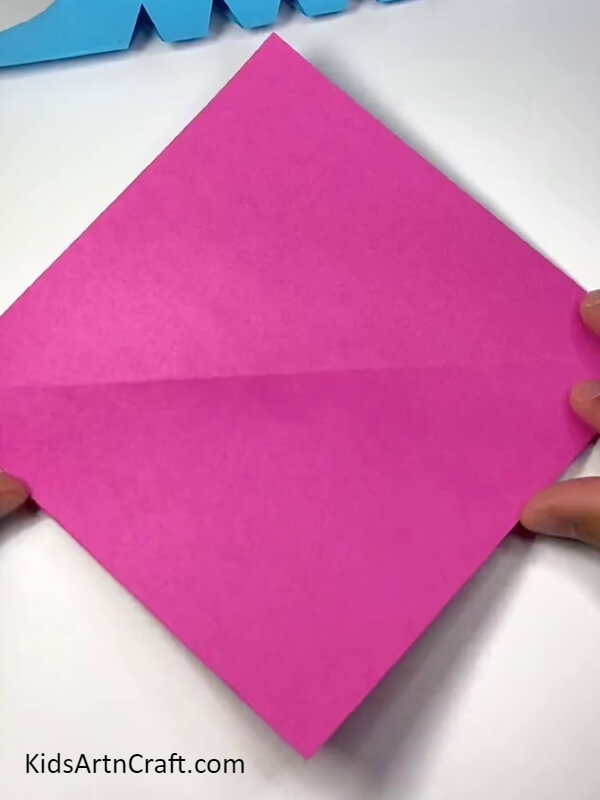 Folding A Pink Square. Cute Paper Dinosaur Craft Tutorial for kids