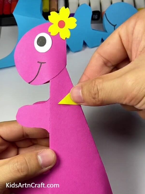 Pasting The Spikes. Cute Paper Dinosaur Craft Tutorial for kids