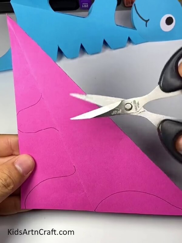Cutting The Dinosaur's Body. Cute dinosaur craft for kids