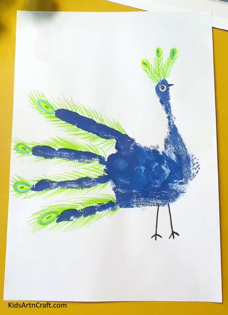 Highlighting all the patterns- An Enchanting Peacock Handprint Art & Craft Concept For Children