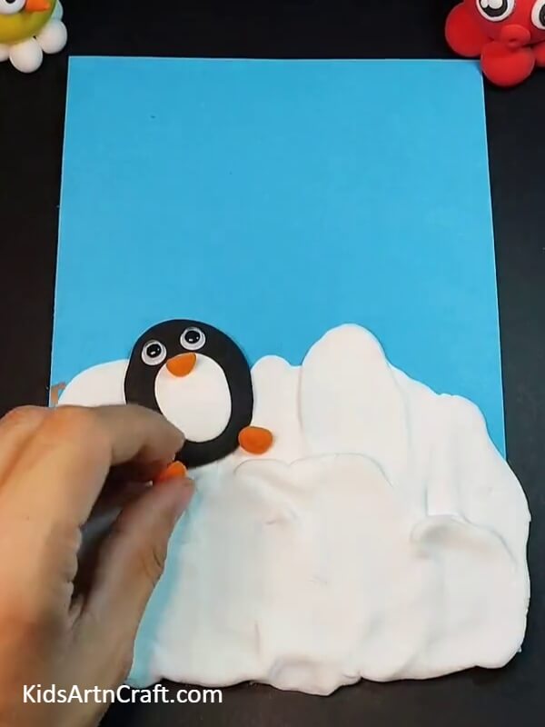 Making mother penguin's foot and pe- A Tutorial To Assist Kids In Making Delightful Penguin Clay Figuresak
