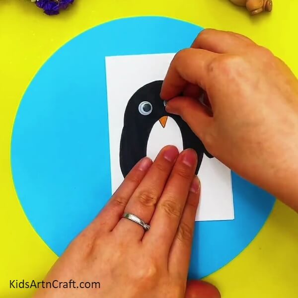 Pasting The Googly Eyes-Fun Penguins Paper Art Activity Tutorial for Kids 