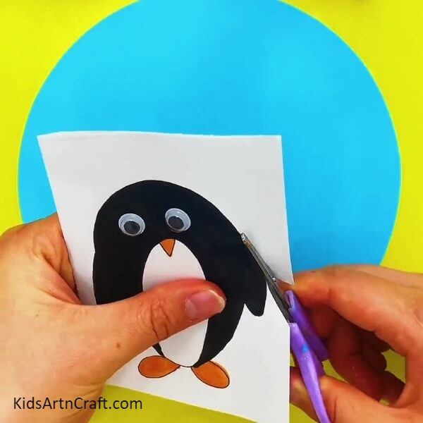 Cutting The Penguin Shape Out- Lovely Penguins Paper Crafting Guide for Kids 