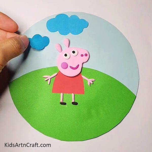 place the cloud cutouts-Charming Peppa Pig Scene Crafting for beginners