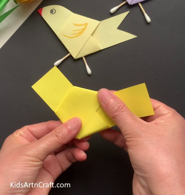 Flattening The Knot - Making a bird-inspired craft with paper and earphone pieces.