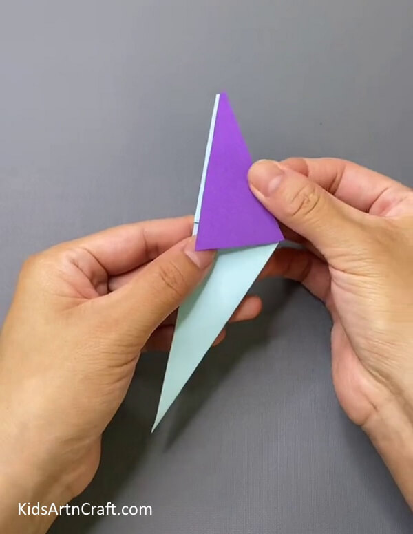 Pasting The Purple Triangle- Design a bird-themed puppet that can be worn on the hand