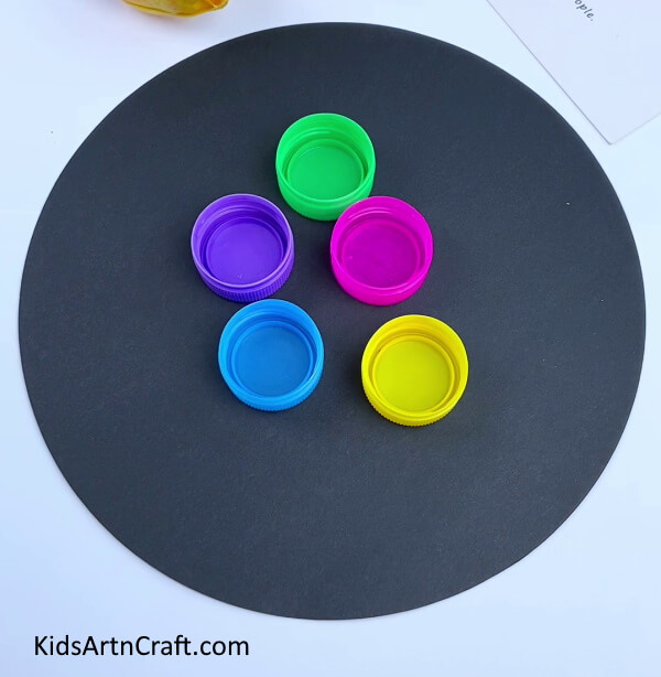Gathering Colorful Bottle Caps And Clay snail Easy craft for kids
