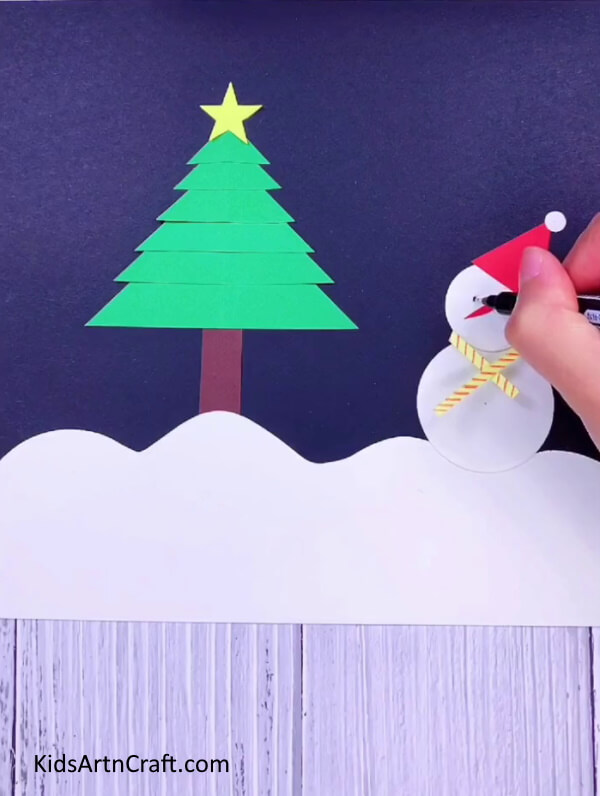 Add details like cap, eyes and nose- Form a Christmas Tree with your own resources for a sprightly decoration.