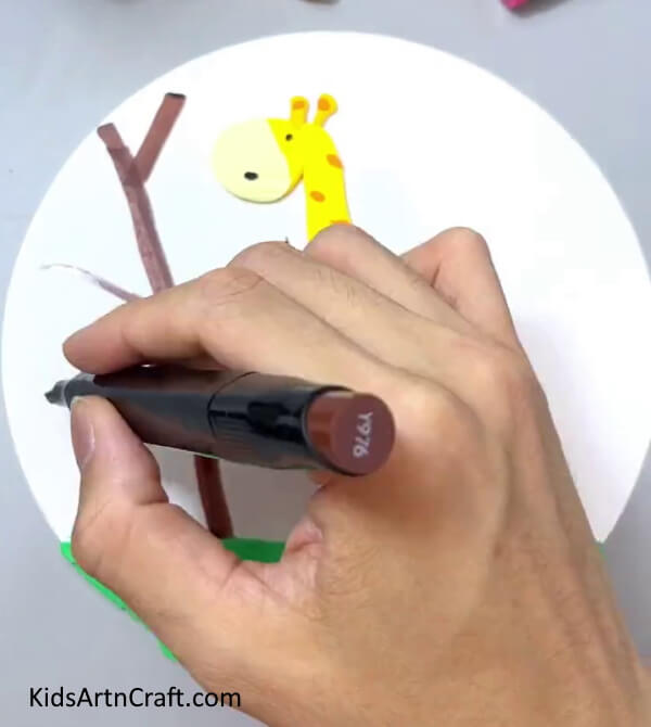 Drawing Tree With Brown Marker - Steps for kids to follow when crafting a Clay Giraffe