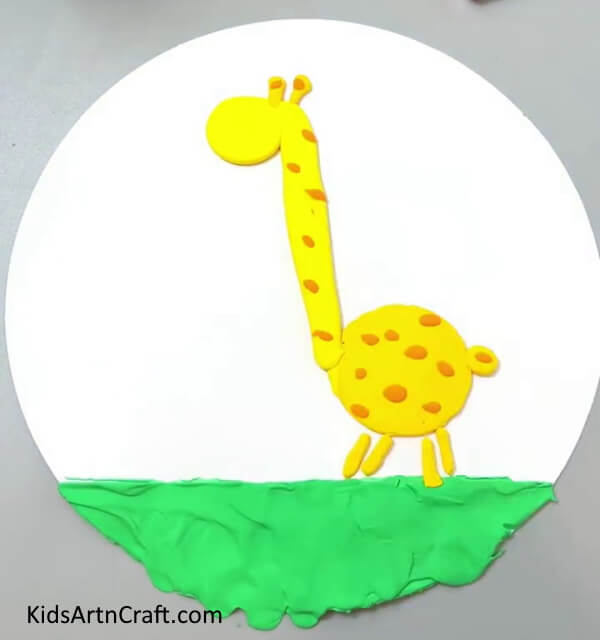 Making Orange Spots On Giraffe - Help kids master the art of making a Clay Giraffe with this tutorial