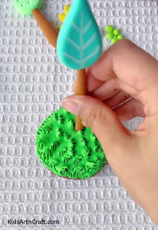 Stick The Drop Shape Tree On The Grass Area-Crafting Clay Trees with Ease - An Easy-to-Follow Guide for Kids