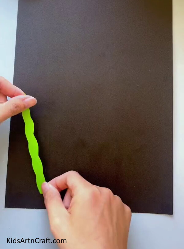 Pasting Sea Grass Creating a Fish Aquarium from Craft Paper for kids