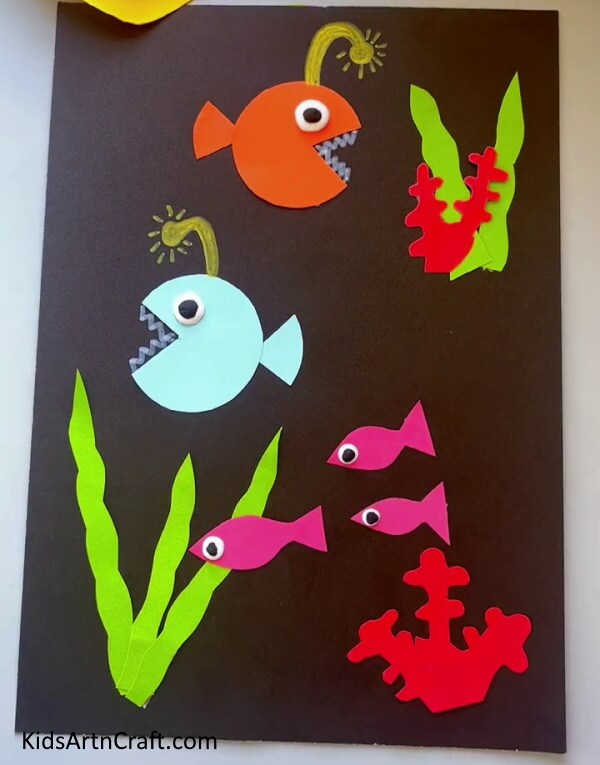 Pasting Eyes Of The Fishes Constructing a Fish Tank from Craft Paper for the little ones 