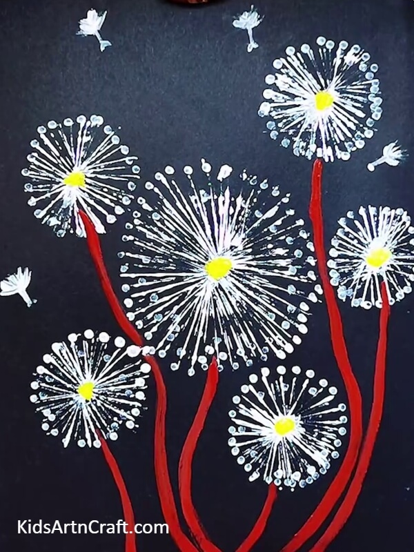 Making more stems with the red paint- Crafting with Dandelions - A Fun and Creative Painting Project for Little Ones
