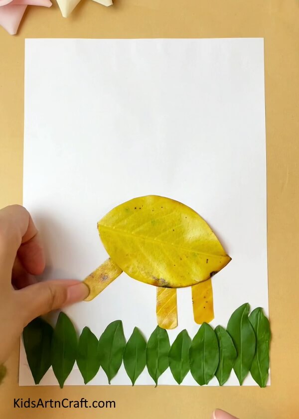 Legs of the Dinosaur- A Step-By-Step Guide on Crafting a Dinosaur Animal Out of Leaves for Children