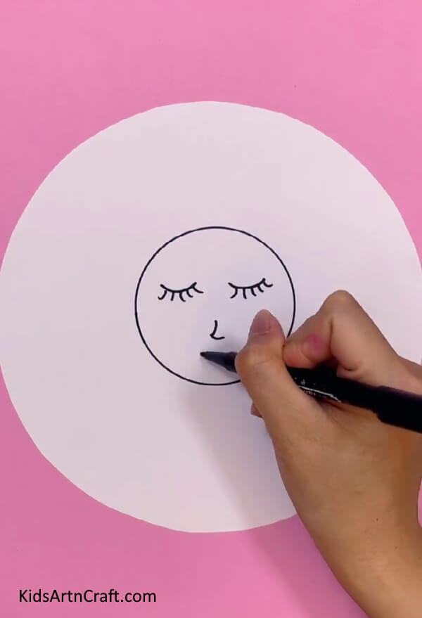 Drawing The Doll's Face - Follow this tutorial to make your own doll with ease.