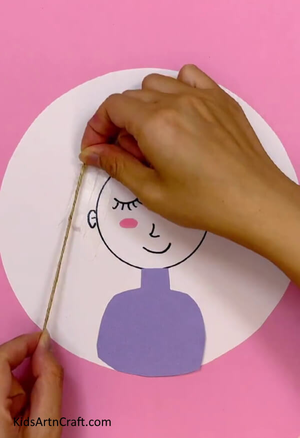 Making The Doll's Hair - Create a doll of your own with this easy-to-follow guide for children.
