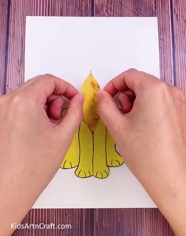 Pasting Leaves In The Middle Of The Drawing-Produce a Lion Craft Effortlessly With Leaves From Fall Inside Your Home