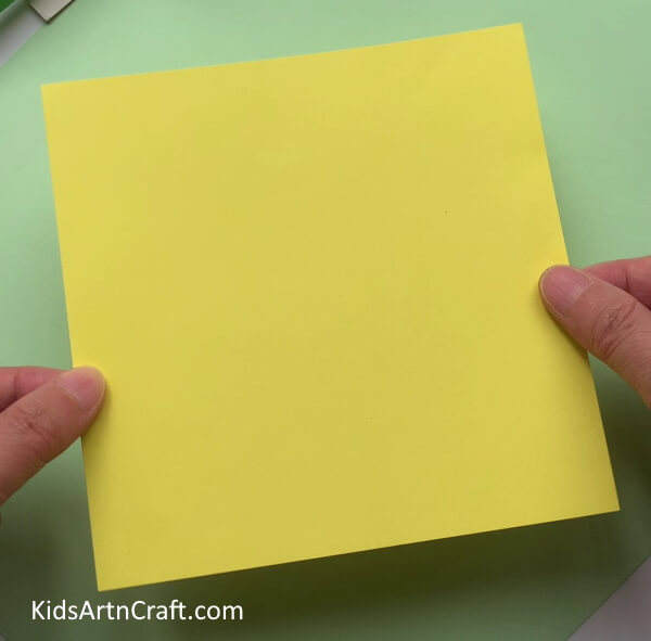 Taking A Square Yellow Paper - Make this straightforward paper honey bee craft with your children.
