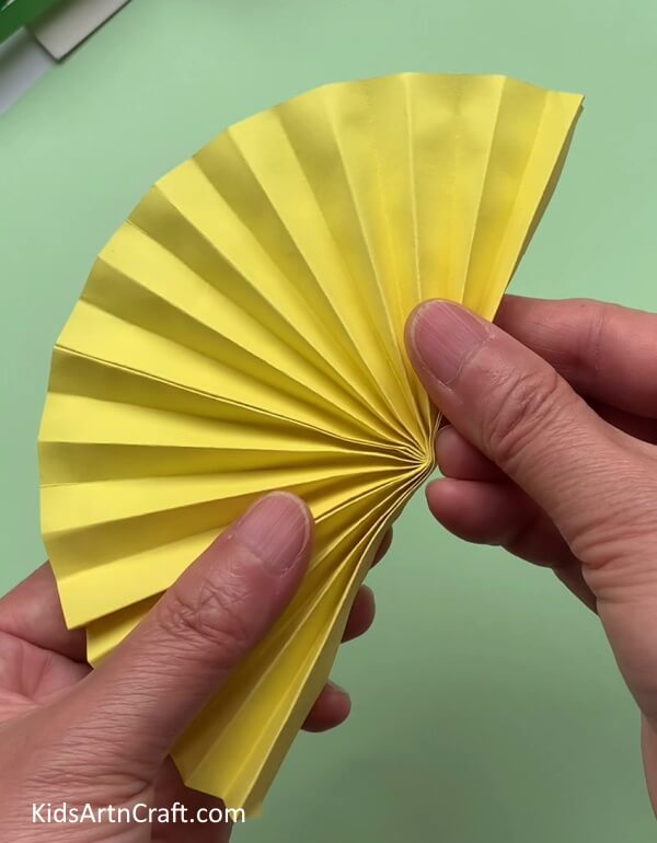 Pasting the Ends Of Strips Together - Let your children help you make this easy paper bee craft.
