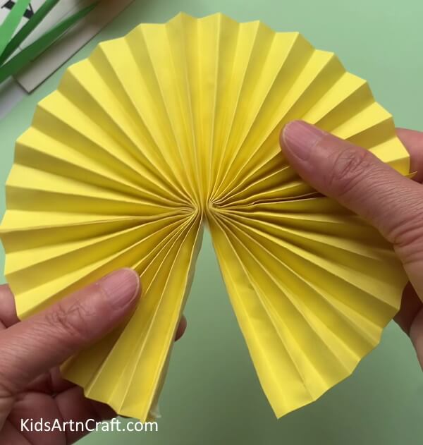 Pasting Both The Strips From One End - Make this basic paper bee craft with your kids.